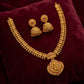 Gold necklace and earrings set on a maroon fabric background